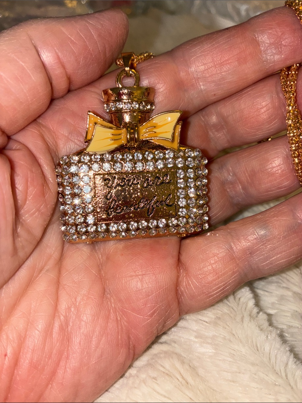 Crystal Perfume Bottle Pendant Necklace Yellow Bow. “You are beautiful” it says